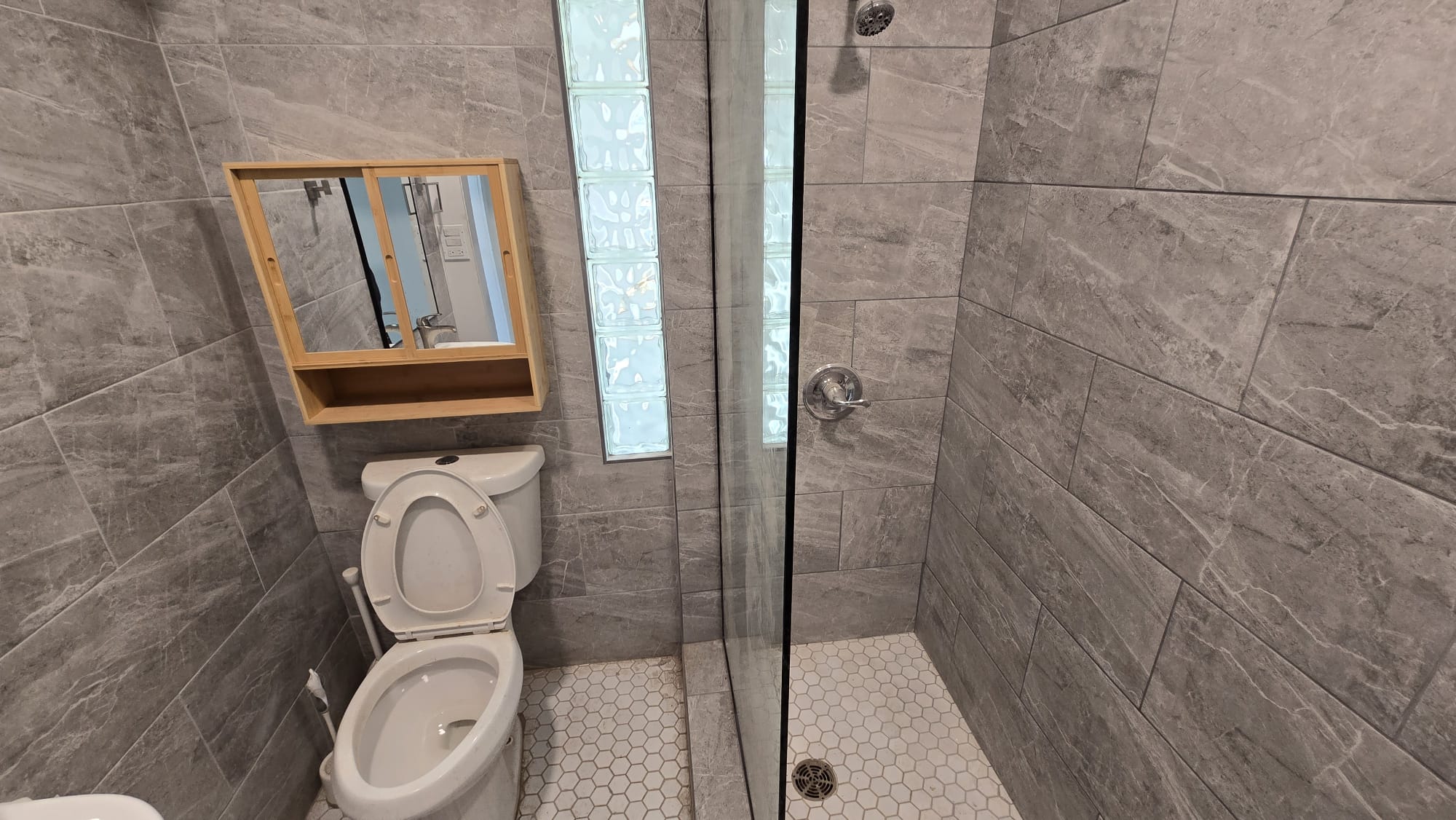 Completed Bathroom — Gray Tile & Walk-In Shower